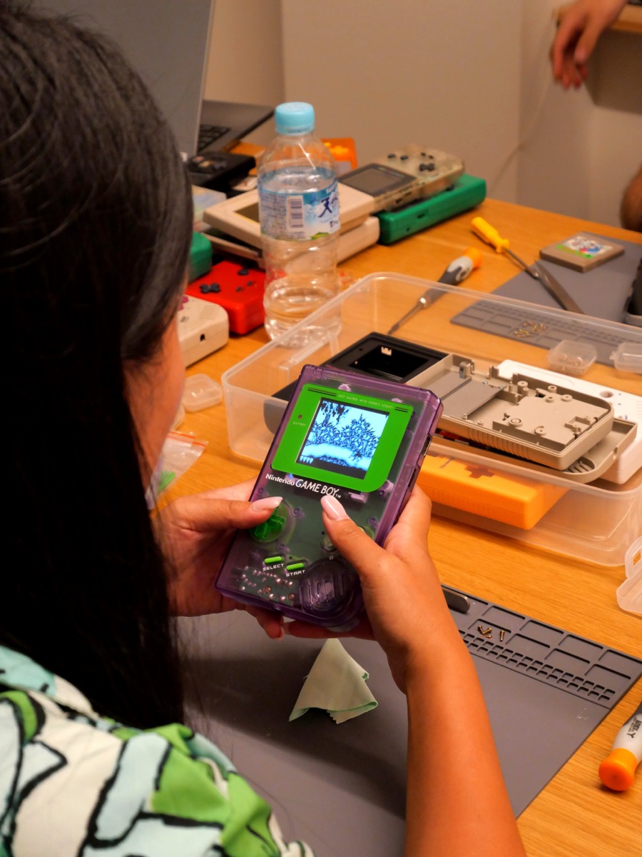 Purple Game Boy being played